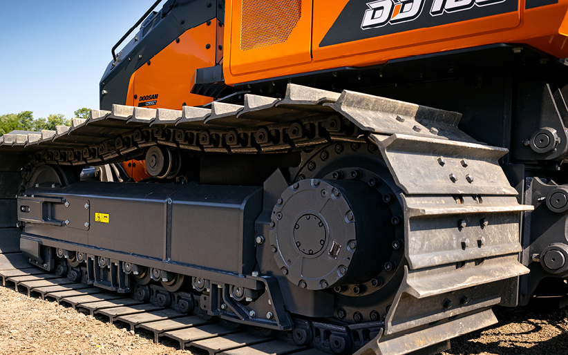 The tracked undercarriage of a Doosan DD100 dozer.