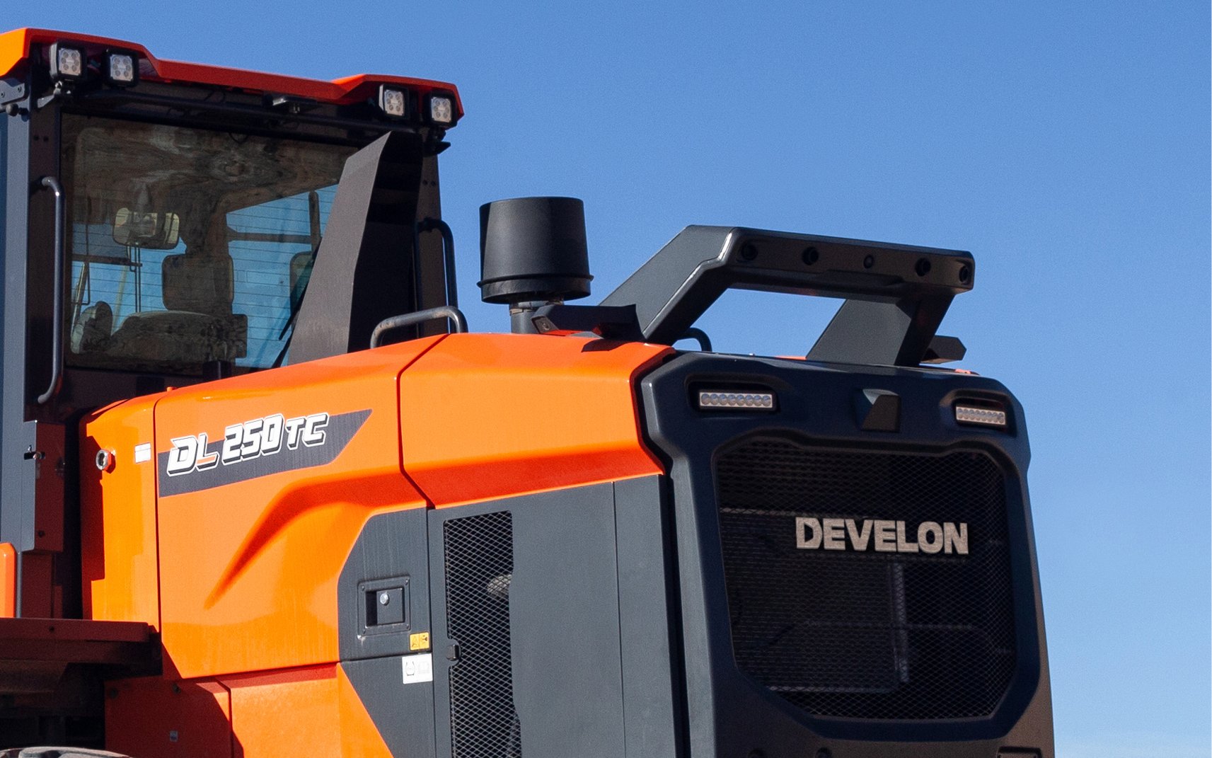 The around view monitor camera system safety feature is shown on a DL250TC-7 wheel loader.
